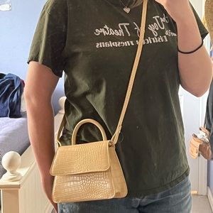 Small Yellow crossbody bag with small extra handle.